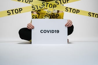 person-holding-covid-sign-3951600